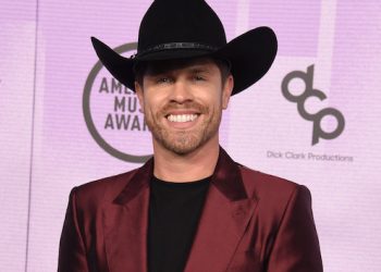 Dustin Lynch swaps his cowboy hat for a Santa cap in heartwarming, charity-focused new music video