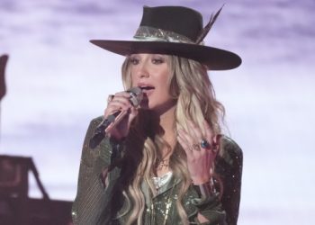Rain can’t stop Lainey from performing for her fans