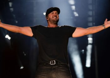 Luke Bryan couldn’t “get away from the catchiness” of “But I Got A Beer In My Hand,” so he recorded it