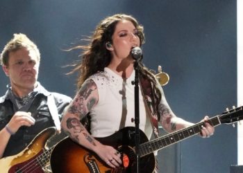 Ashley McBryde’s a big fan of Ronnie Milsap + Karen Carpenter
